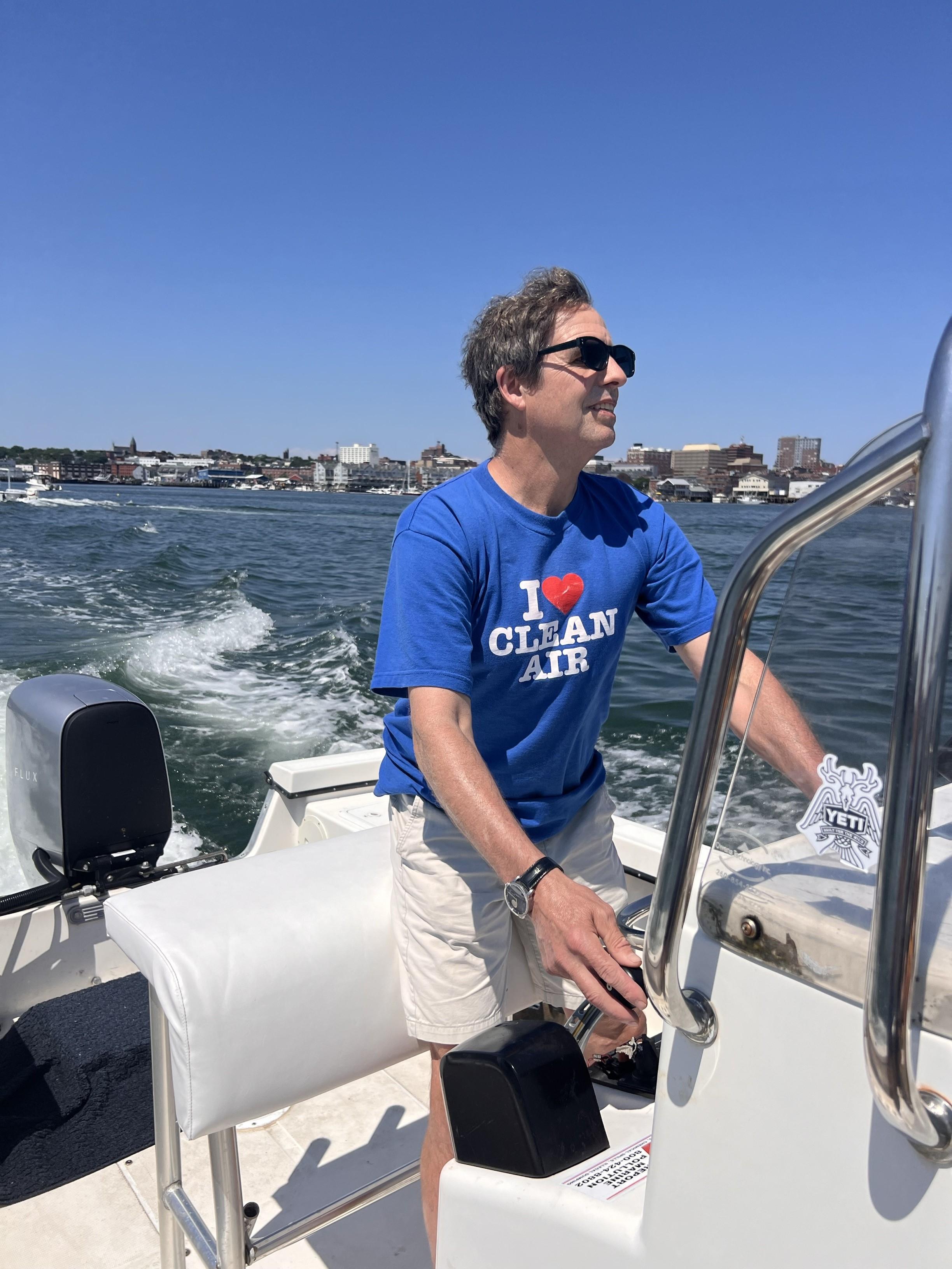 ReVision Energy co-founder Phil Coup on his electric boat in June 2024